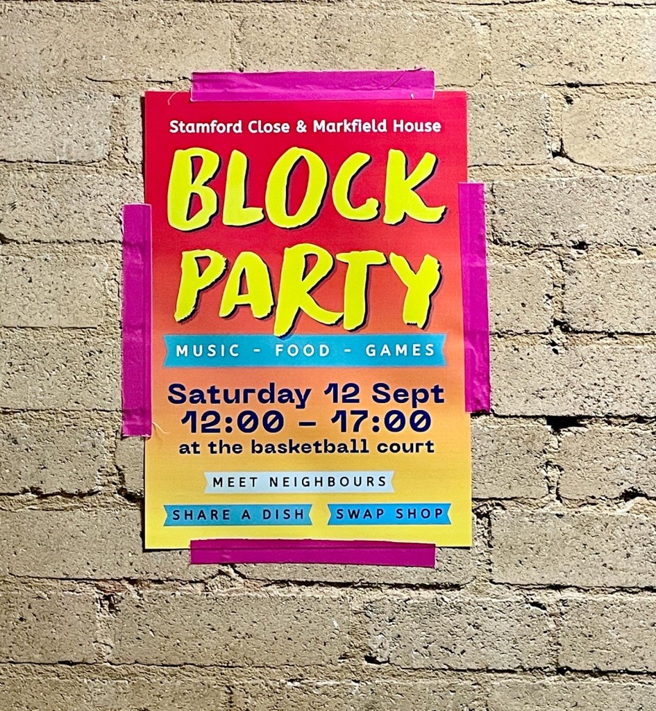 A brightly coloured poster advertises a neighbourhood block party 